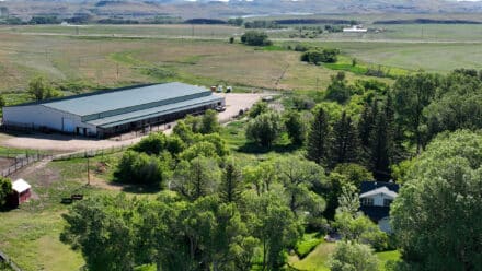 Triangle S Ranch view of the home, arena and lake desmet